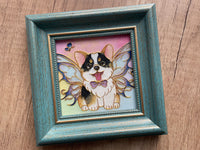 Actual framed corgi artwork showing the raised outlines, textured colour and vintage-blue frame