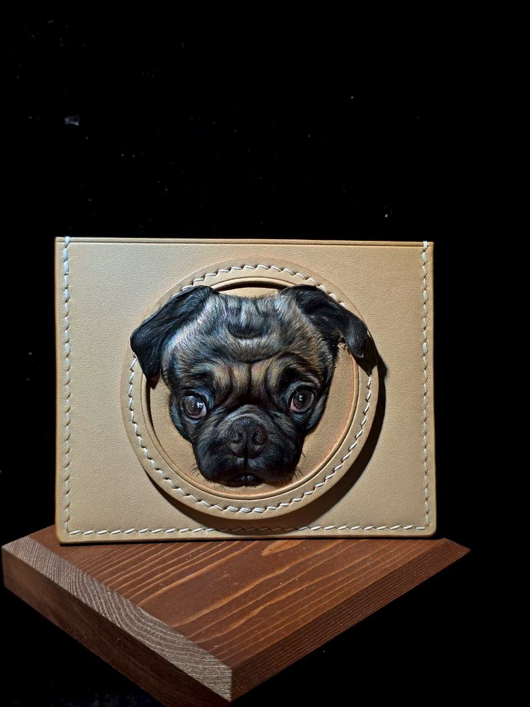 Supplier photograph of a cream leather cardholder with a pug portrait.