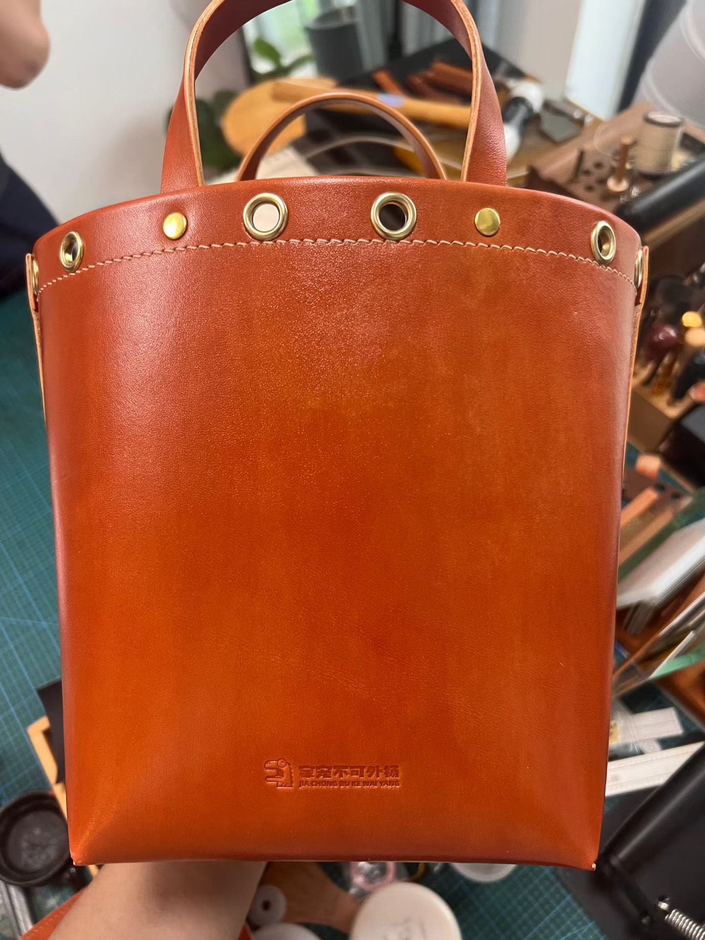 Supplier photograph of the leather tote back, retaining the original maker stamp.